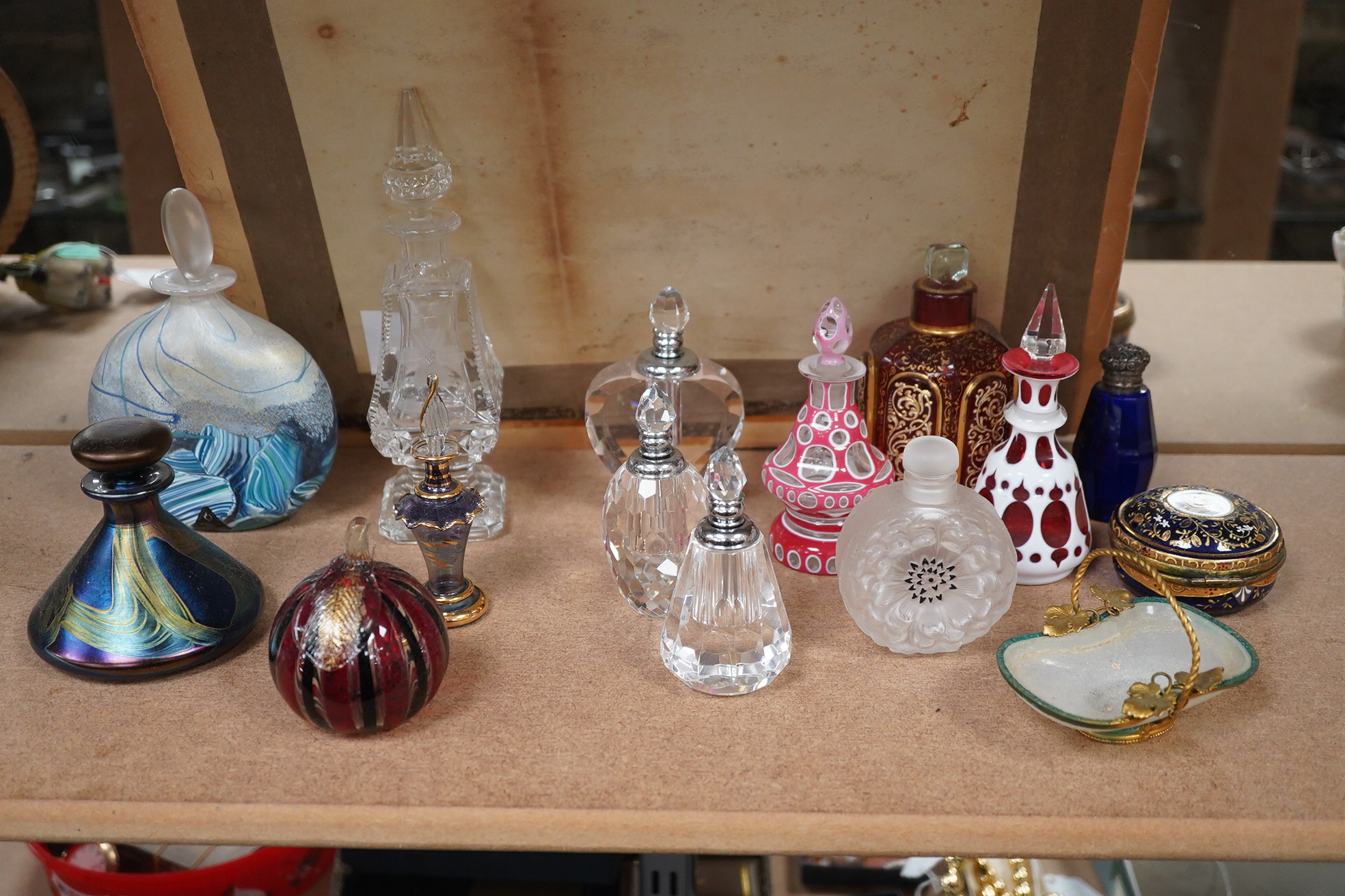 A collection of various glass scent bottles including a Lalique flower scent bottle and Bohemian examples, tallest 20.5cm. Condition - fair, some stoppers stuck